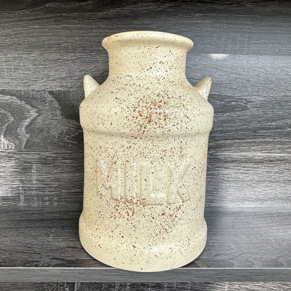 Vintage Cream/brown ceramic milk jug with a speckled design and‎ the word "MILK"
